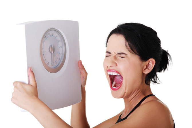 Frustrated-woman-with-scale